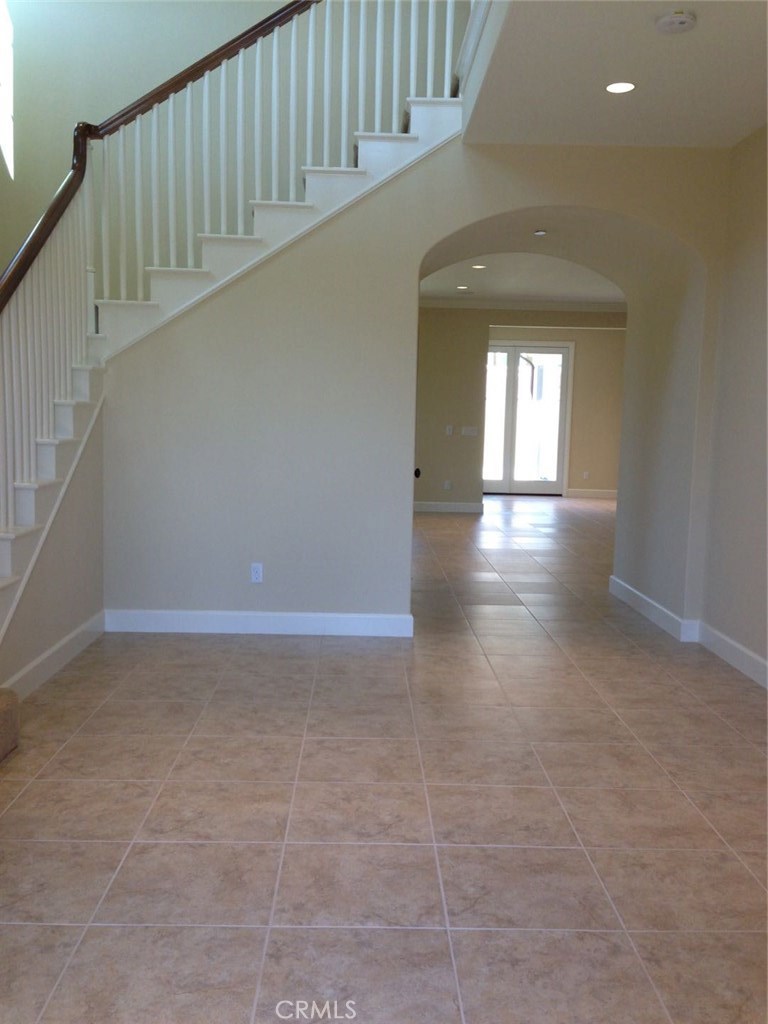 51 Domani Irvine, CA 92618 - Photo 6 of 9 a view of entryway with a hallway