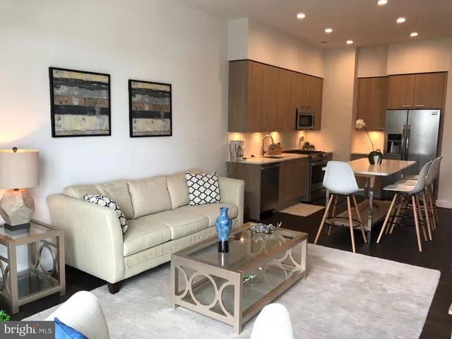 a view of a livingroom with furniture and a flat screen tv