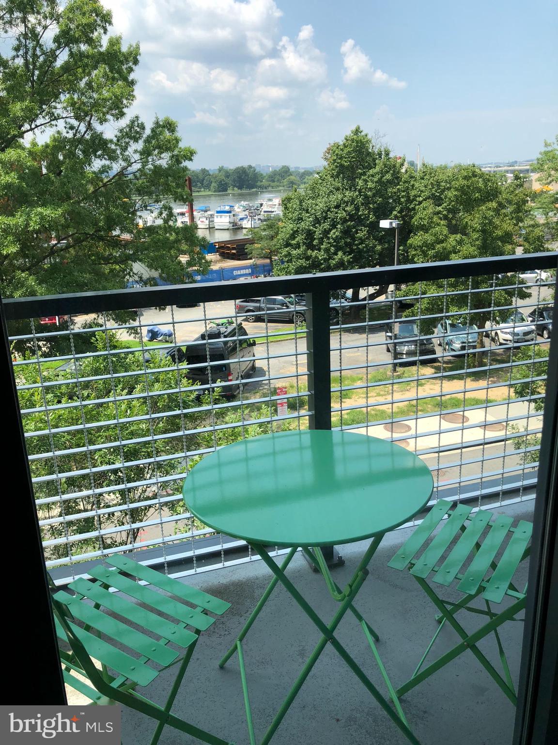 525 Water Street Southwest, Unit 308 Washington, DC 20024 - Photo 20 of 24 a view of a swimming pool with a patio