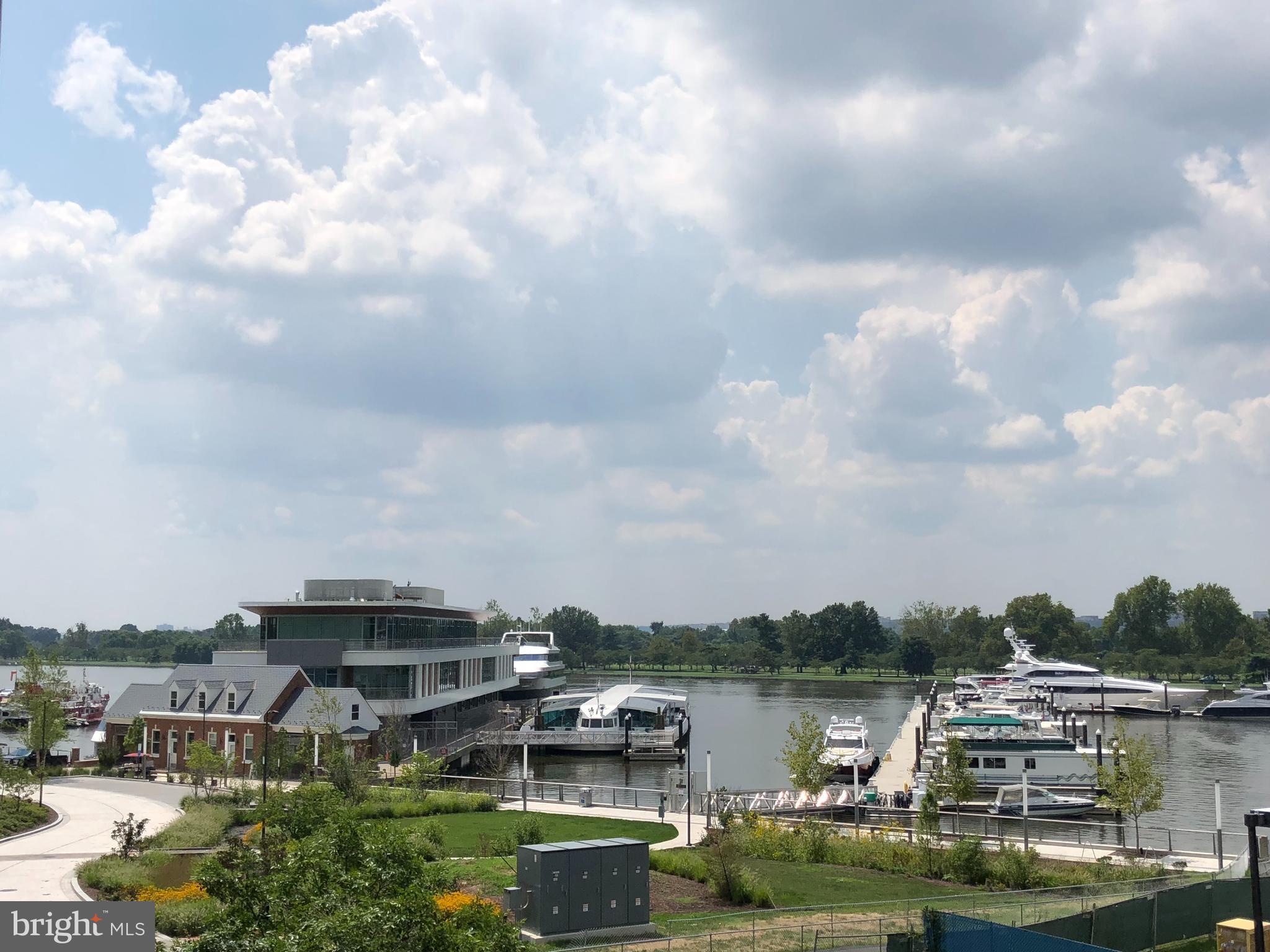 525 Water Street Southwest, Unit 308 Washington, DC 20024 - Photo 21 of 24 a view of a lake with a city in the background