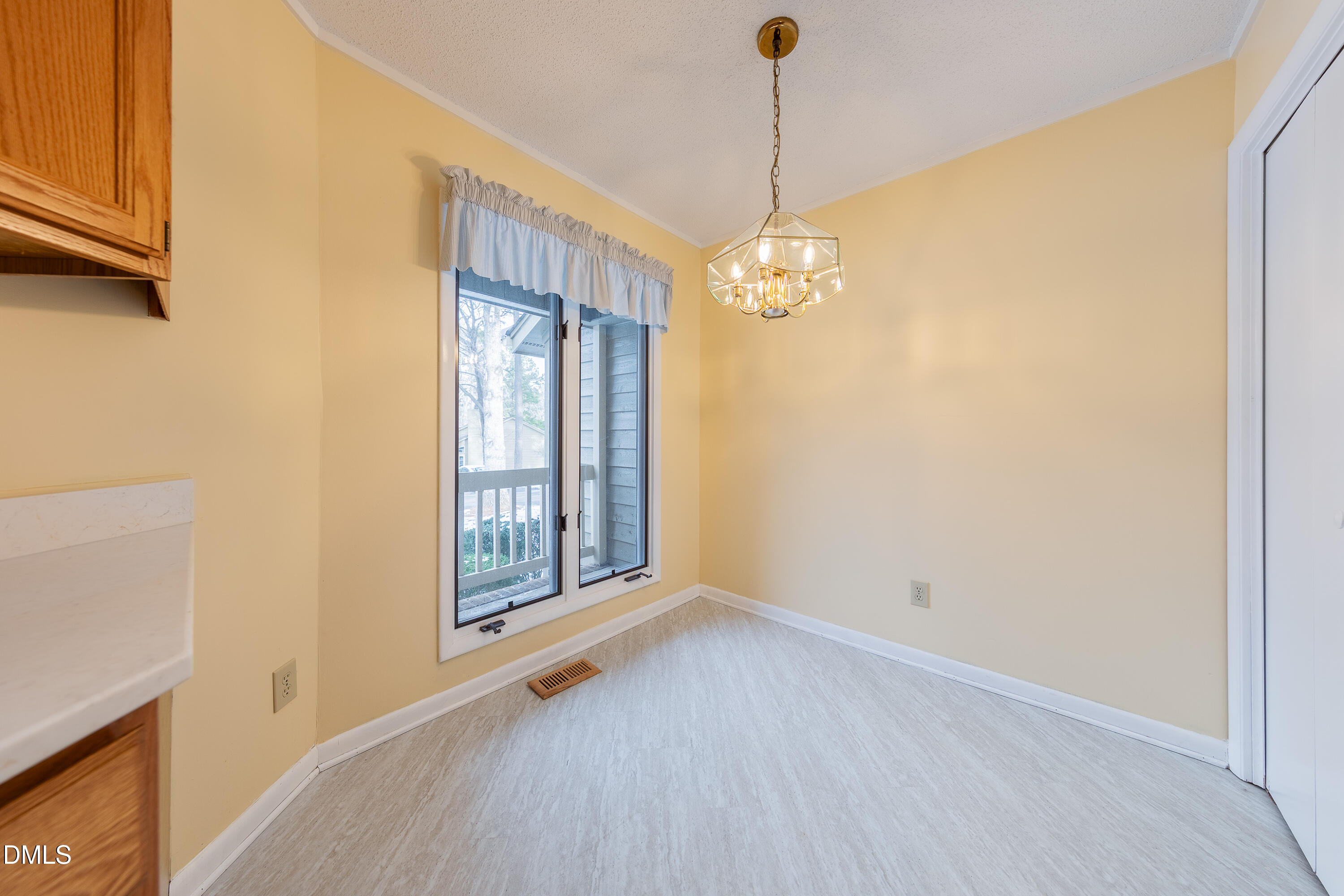 7918 Wood Cove Court Raleigh, NC 27615 - Photo 14 of 31 a view of livingroom with window