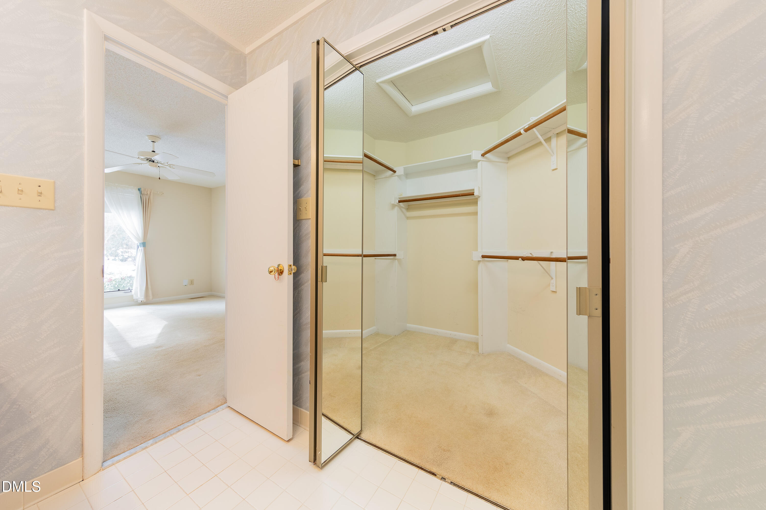 7918 Wood Cove Court Raleigh, NC 27615 - Photo 18 of 31 a bathroom with a glass shower door
