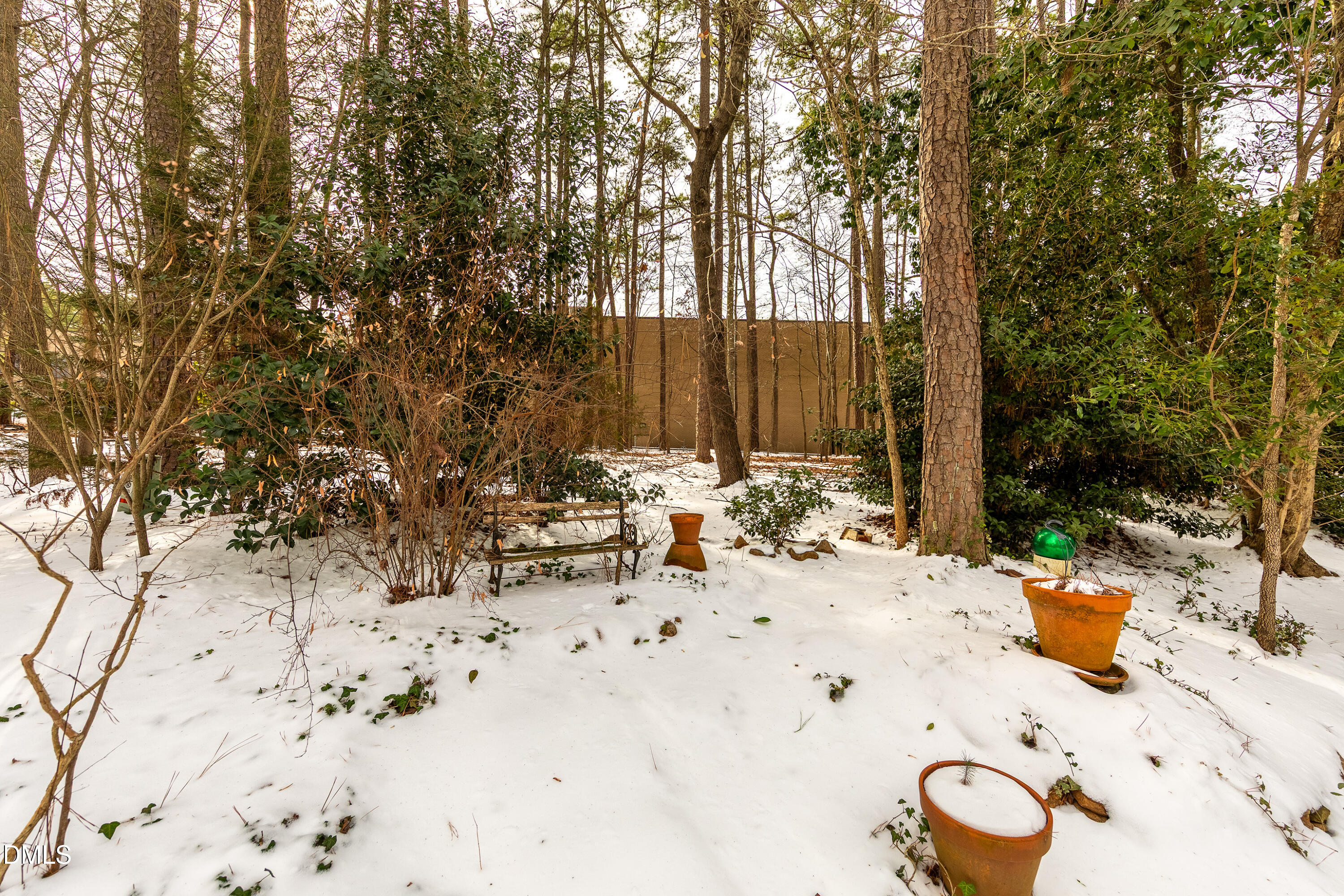 7918 Wood Cove Court Raleigh, NC 27615 - Photo 30 of 31 a view of a terrace with snow on the road