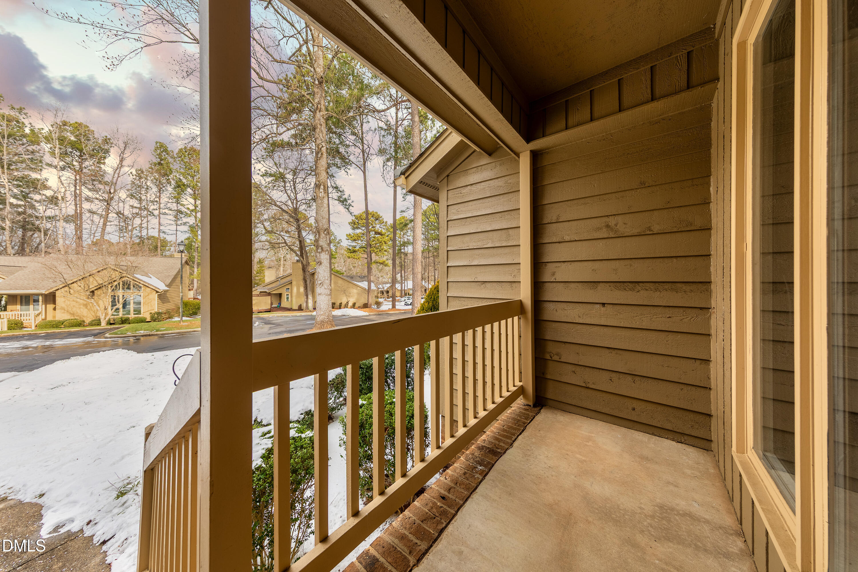 7918 Wood Cove Court Raleigh, NC 27615 - Photo 3 of 31 a view of a porch with wooden floor