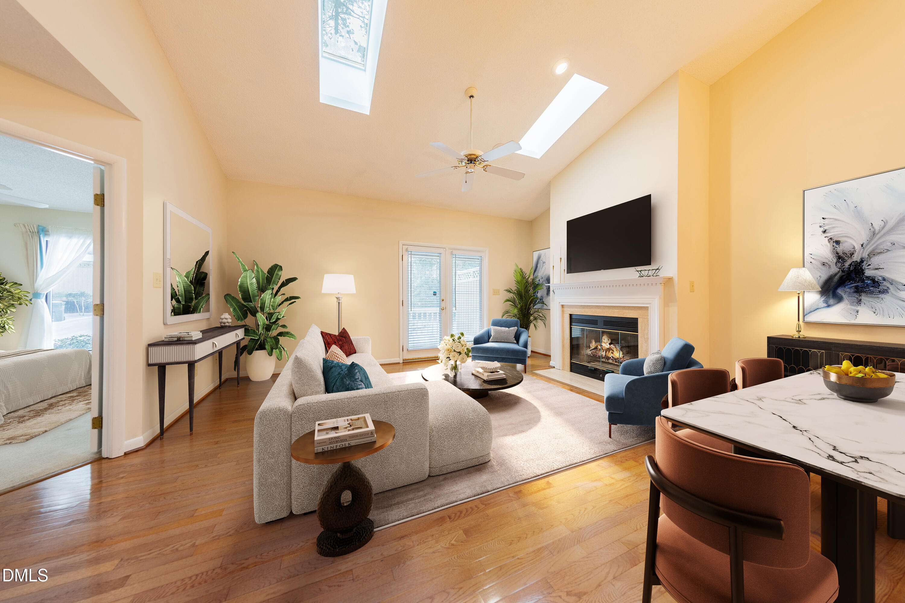 7918 Wood Cove Court Raleigh, NC 27615 - Photo 5 of 31 a living room with furniture a fireplace and a flat screen tv