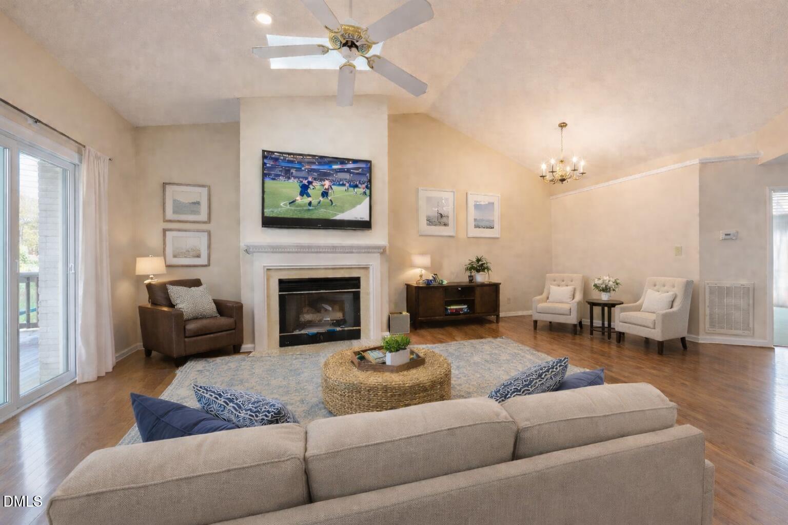 7918 Wood Cove Court Raleigh, NC 27615 - Photo 6 of 31 a living room with furniture and a fireplace