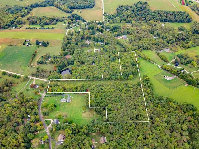 a view of a back yard of the house and front view of a house