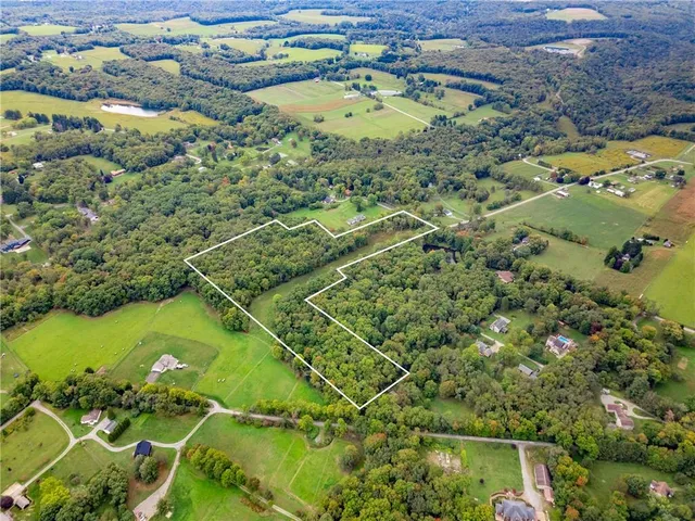 a view of a big yard with lots of green space