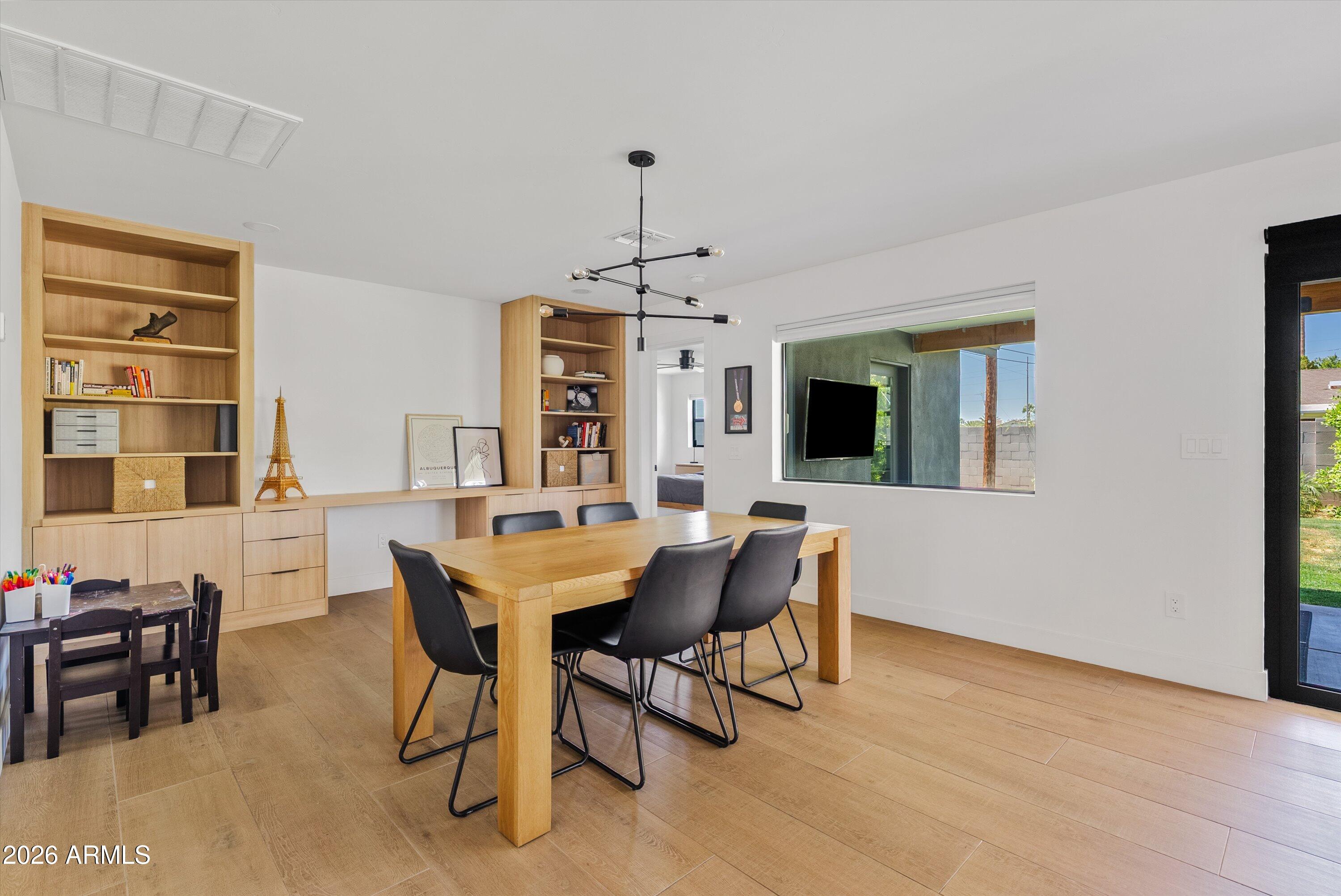 6706 North 12th Way Phoenix, AZ 85014 - Photo 15 of 39 a view of a dining room with furniture