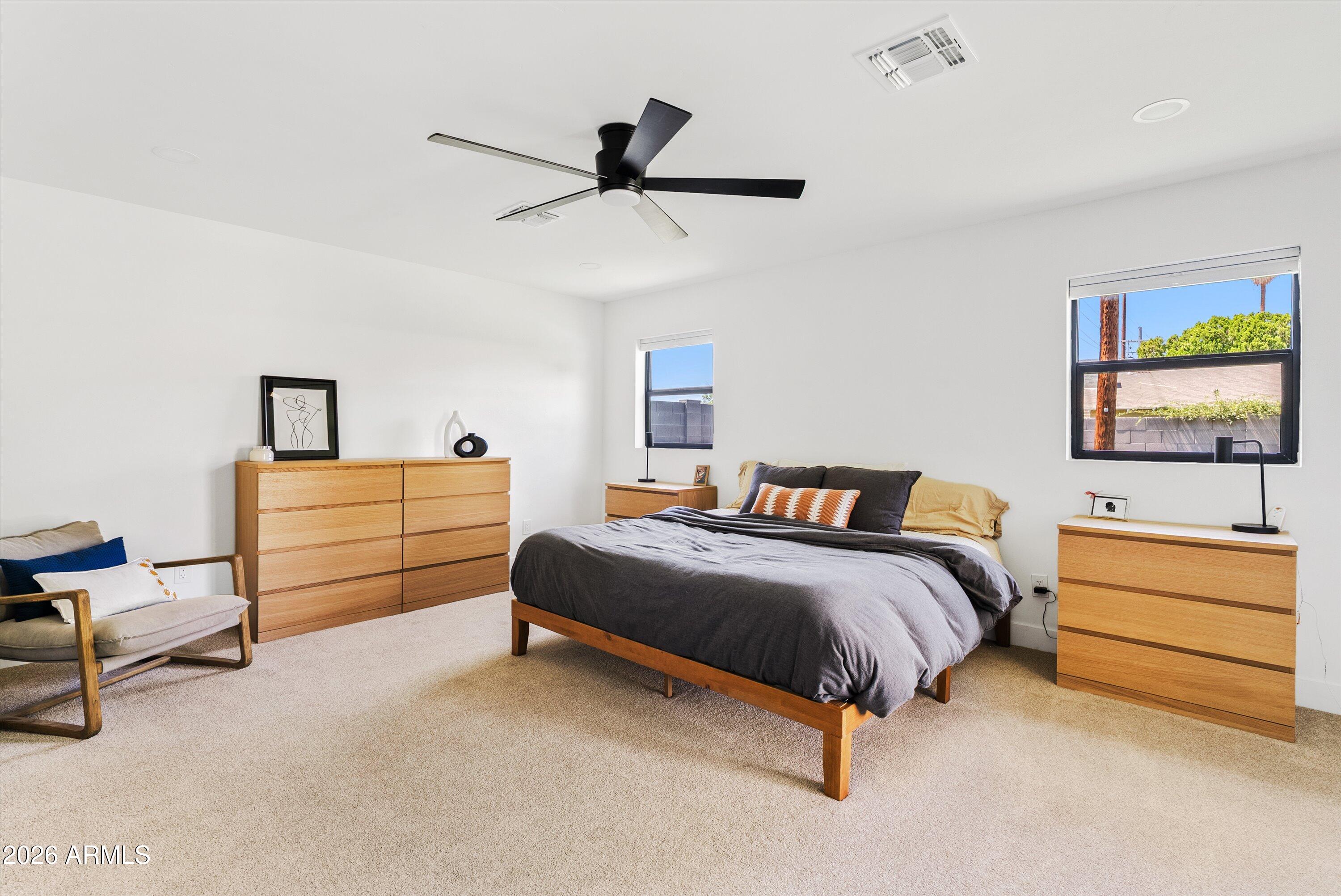 6706 North 12th Way Phoenix, AZ 85014 - Photo 17 of 39 a bedroom with a bed and furniture