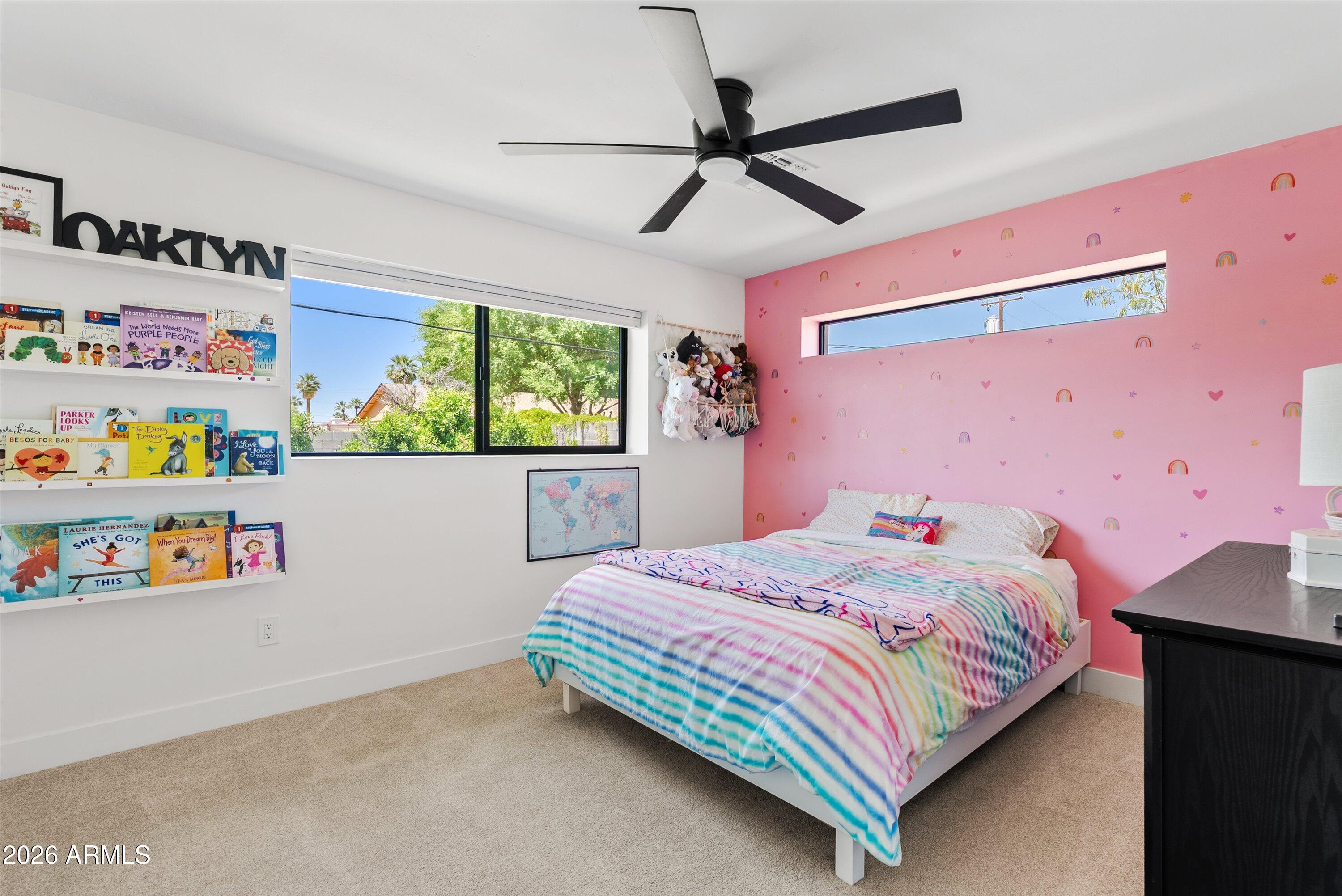 6706 North 12th Way Phoenix, AZ 85014 - Photo 26 of 39 a bedroom with a bed and a window