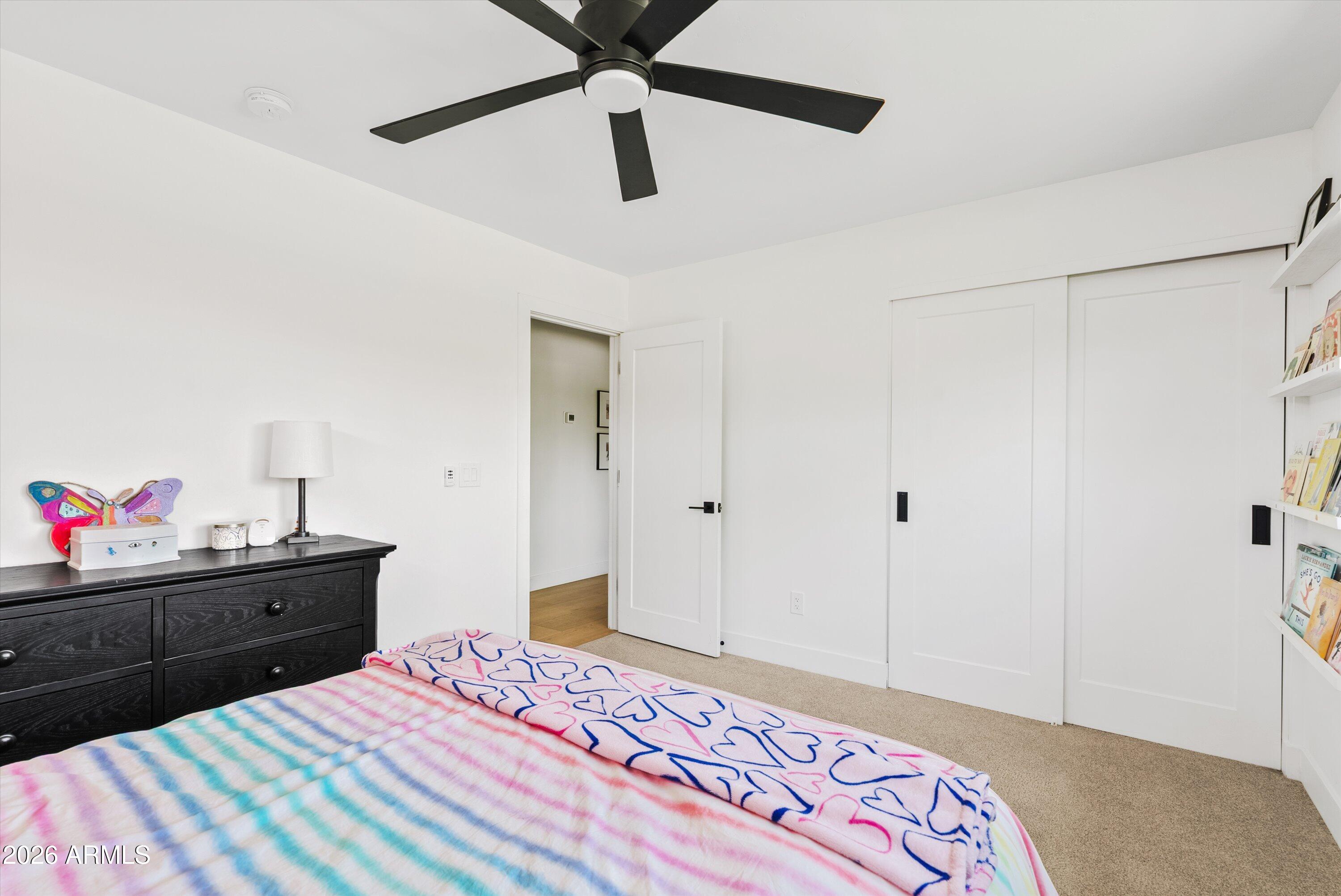 6706 North 12th Way Phoenix, AZ 85014 - Photo 27 of 39 a bedroom with a bed and a dresser