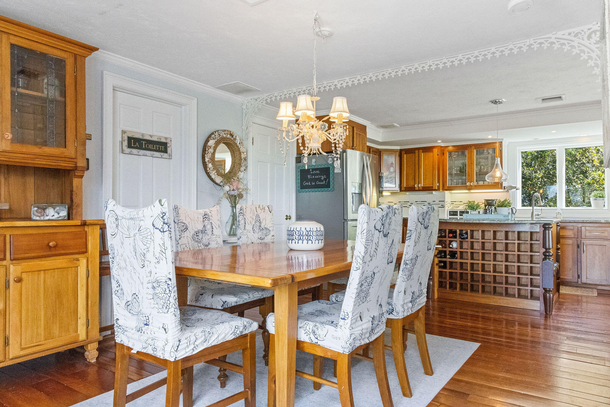 80 Mattakese Road, Unit 7 West Yarmouth, MA 02673 - Photo 11 of 38 a view of a dining room with furniture window and wooden floor