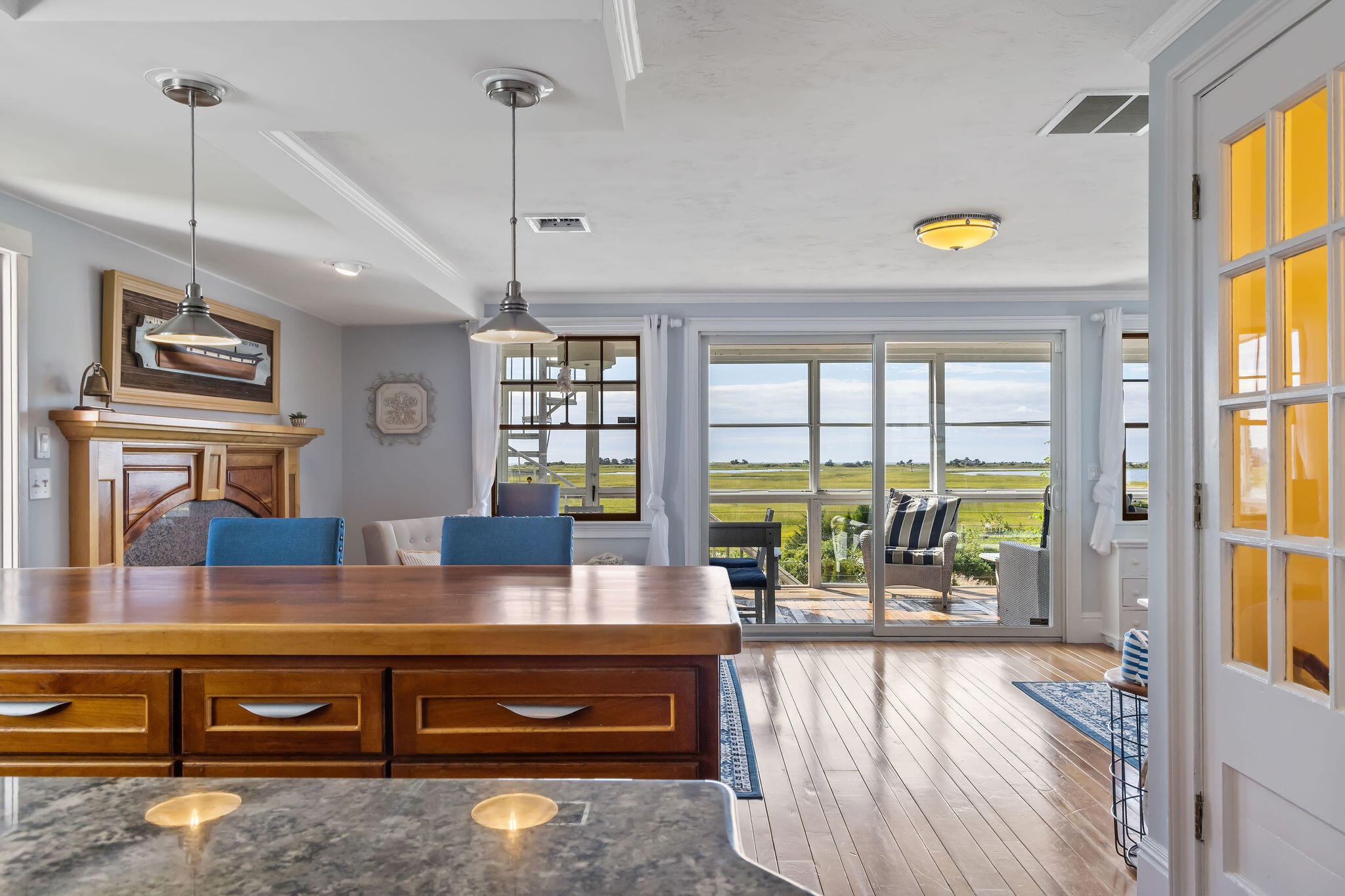 80 Mattakese Road, Unit 7 West Yarmouth, MA 02673 - Photo 13 of 38 a living room with furniture and a floor to ceiling window