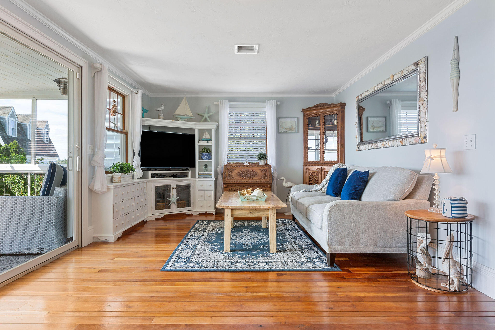 80 Mattakese Road, Unit 7 West Yarmouth, MA 02673 - Photo 17 of 38 a living room with furniture and a flat screen tv