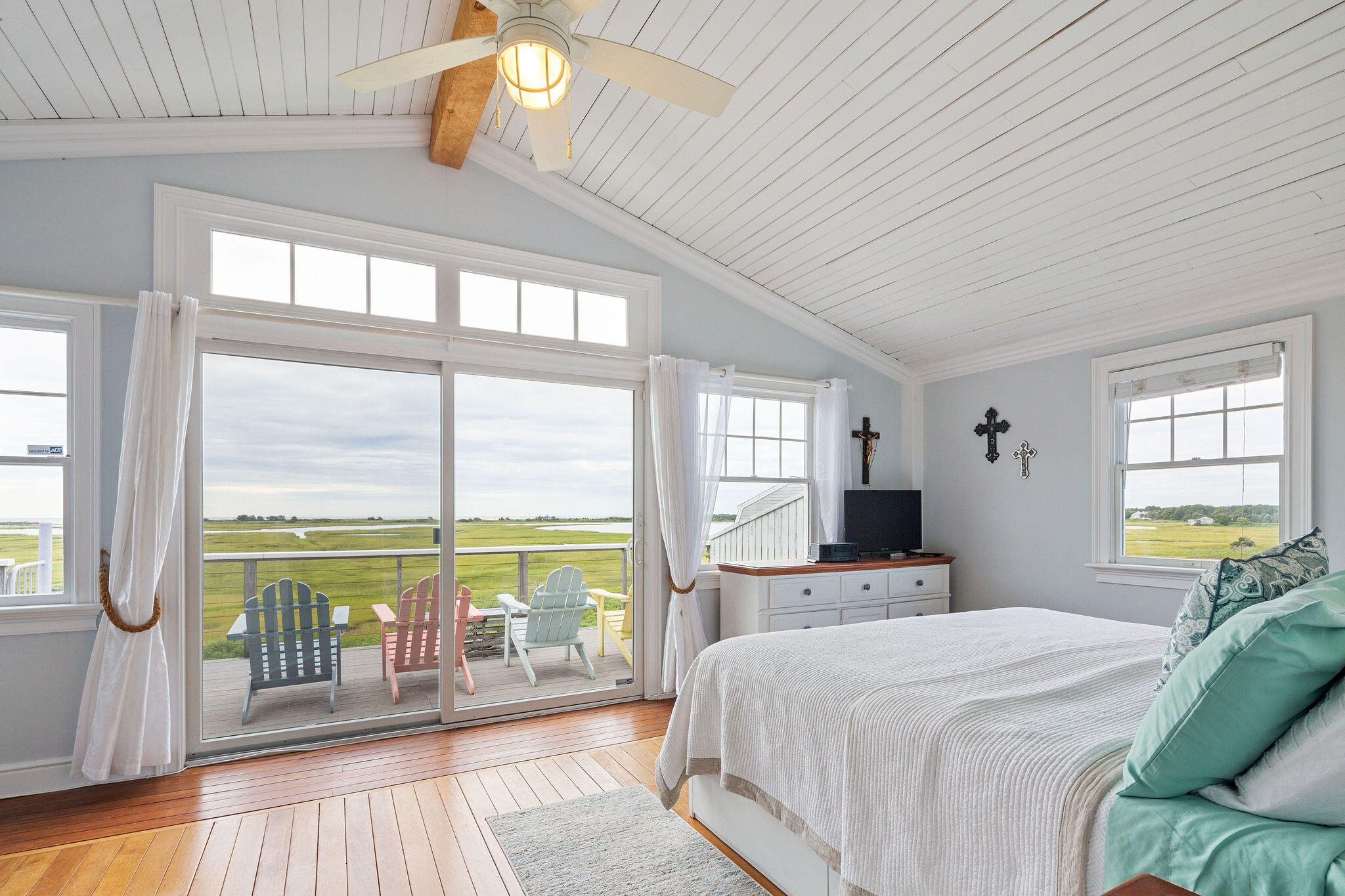 80 Mattakese Road, Unit 7 West Yarmouth, MA 02673 - Photo 22 of 38 a bedroom with a large bed and a large window