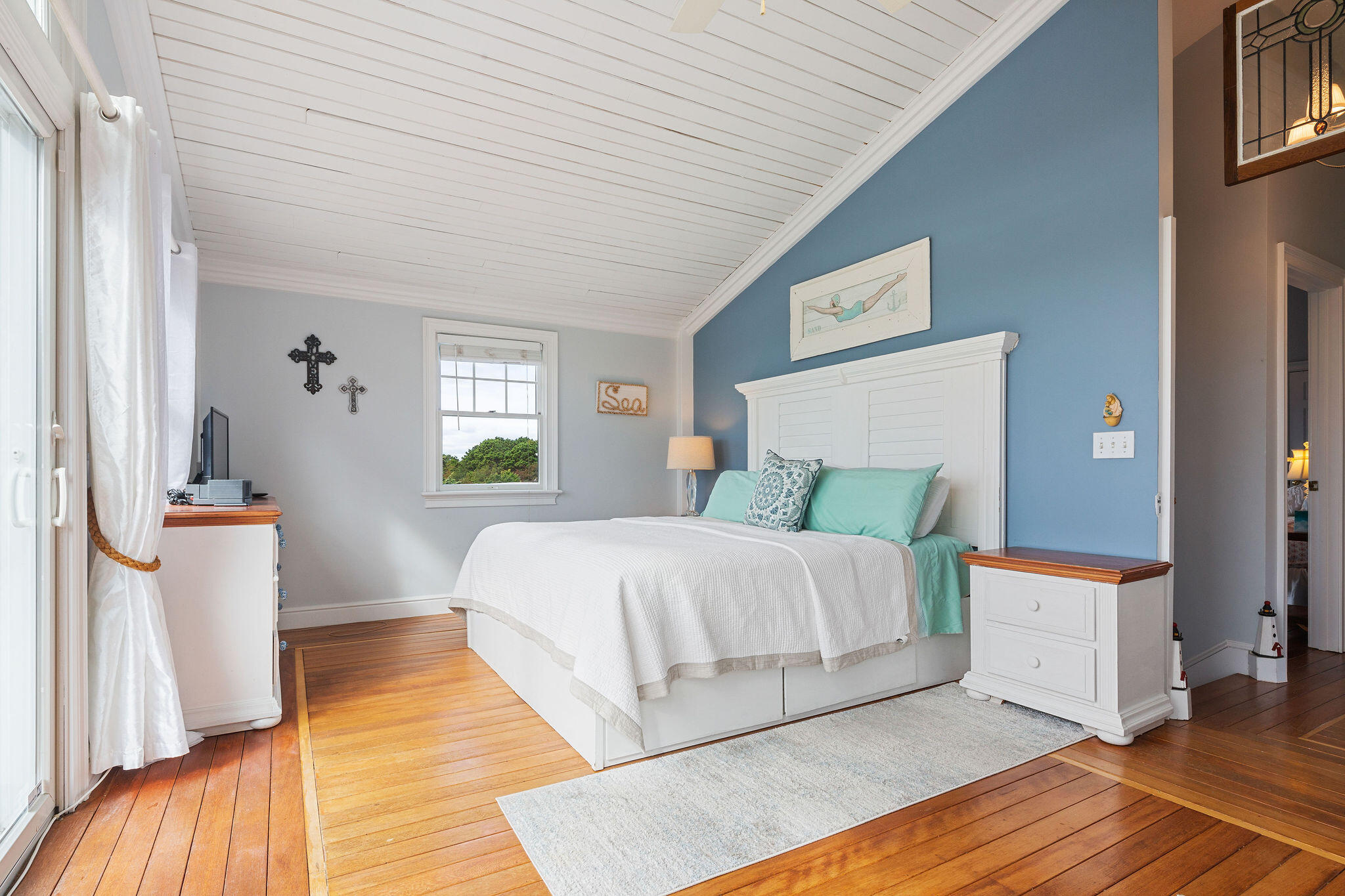 80 Mattakese Road, Unit 7 West Yarmouth, MA 02673 - Photo 23 of 38 a bedroom with a bed and wooden floor