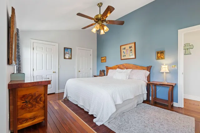 a bedroom with a bed and window