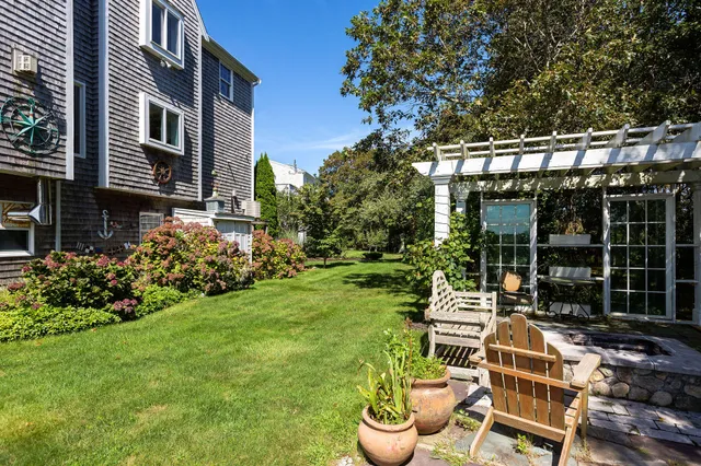 a view of an house with backyard space and garden