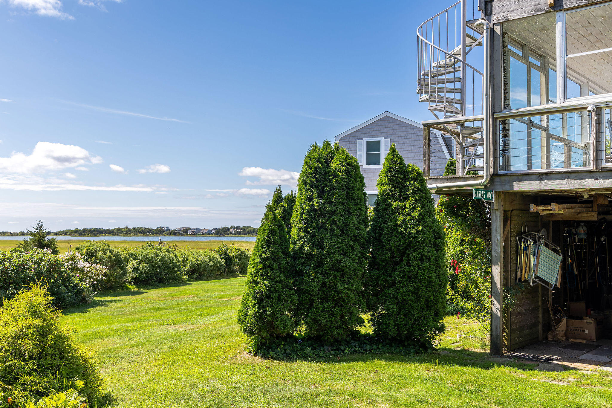 80 Mattakese Road, Unit 7 West Yarmouth, MA 02673 - Photo 4 of 38 a view of a big yard next to a yard