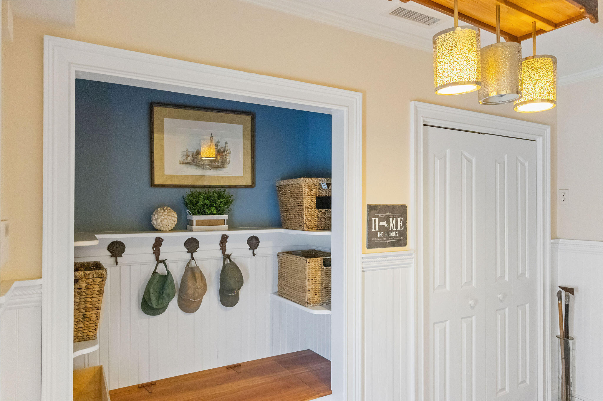 80 Mattakese Road, Unit 7 West Yarmouth, MA 02673 - Photo 7 of 38 a white wall with painting on the wall