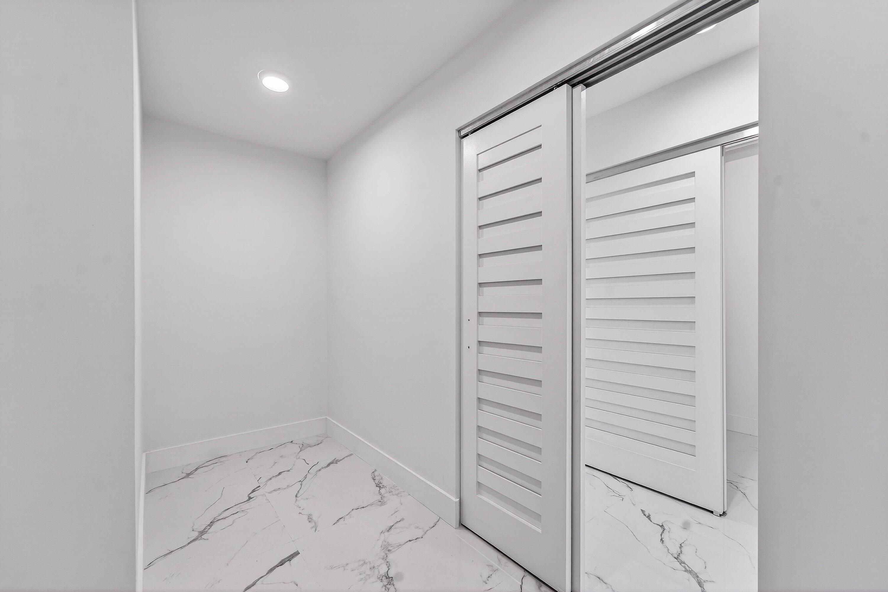 6 Clubhouse Lane Boynton Beach, FL 33436 - Photo 45 of 76 a view of walk in closet with empty racks