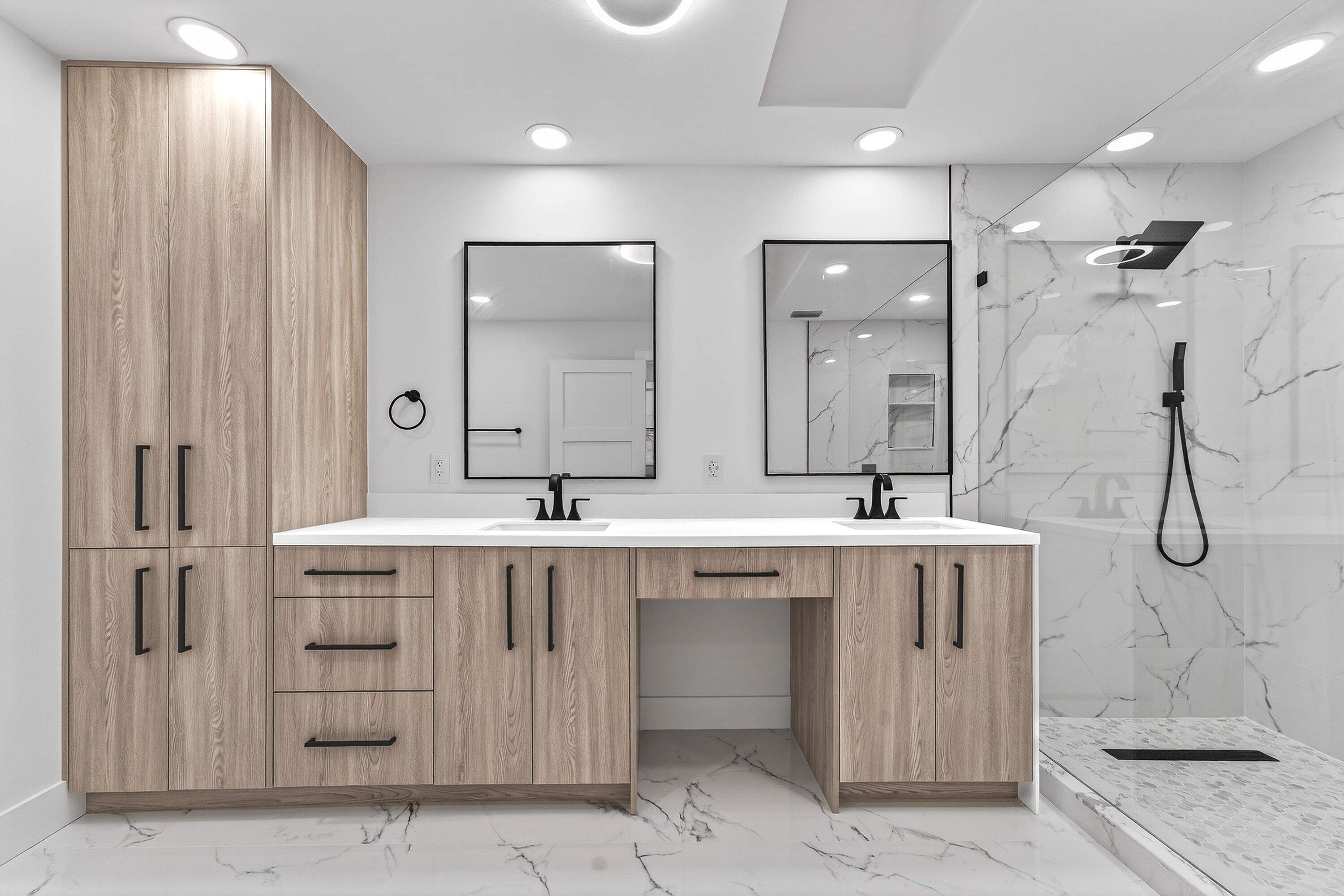 6 Clubhouse Lane Boynton Beach, FL 33436 - Photo 46 of 76 a spacious bathroom with a double vanity sink a mirror and a shower