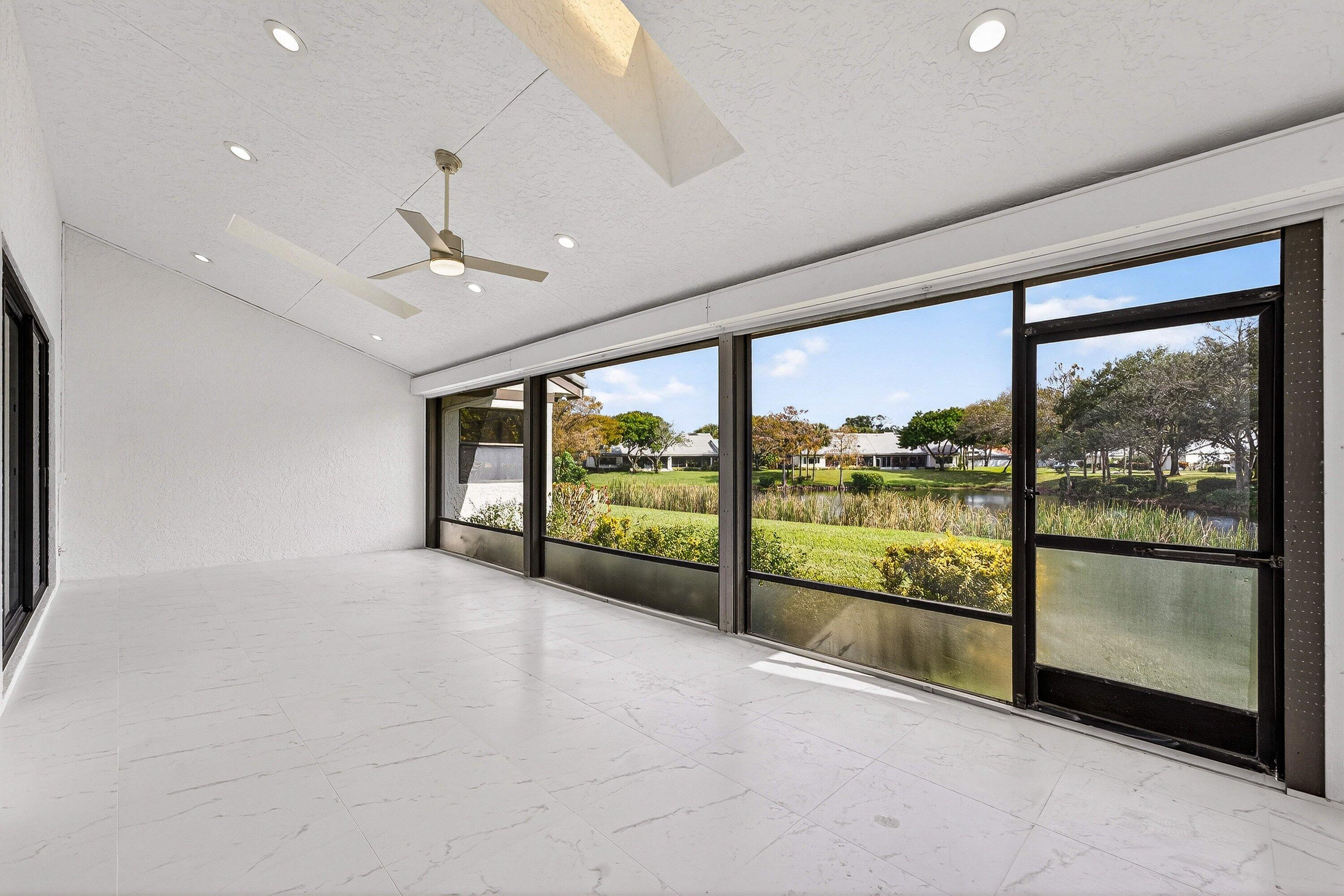 6 Clubhouse Lane Boynton Beach, FL 33436 - Photo 57 of 76 a view of an empty room with a large window