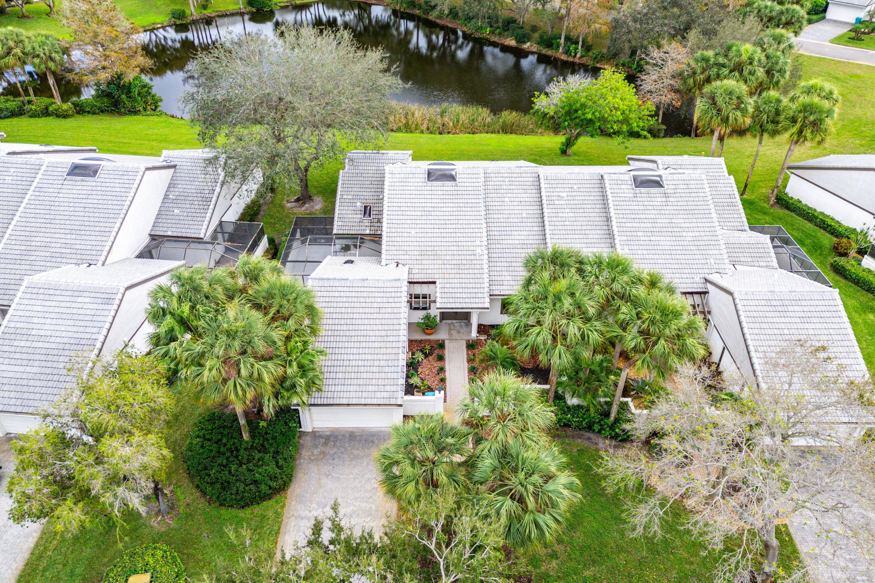 6 Clubhouse Lane Boynton Beach, FL 33436 - Photo 63 of 76 an aerial view of a house with a yard and potted plants