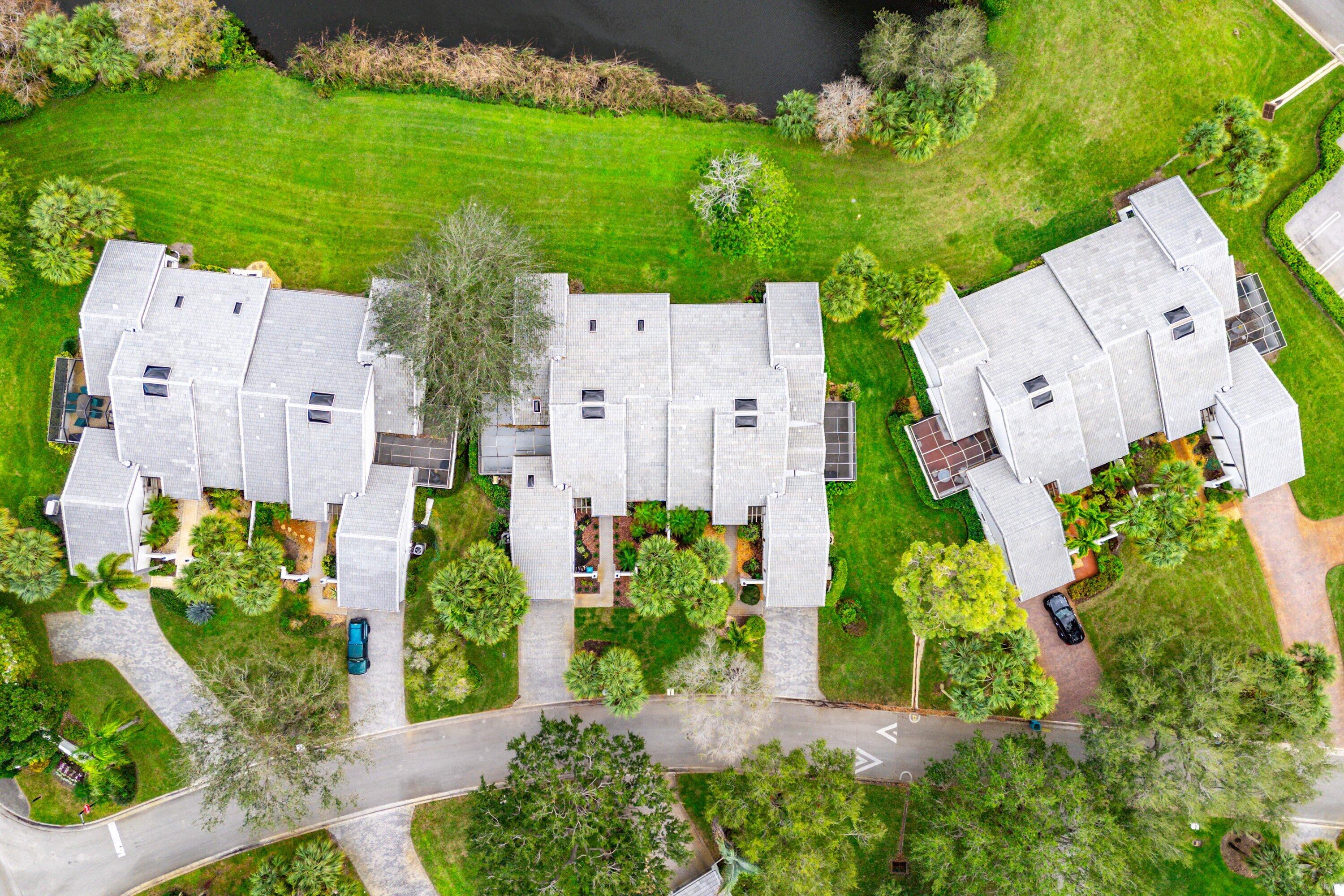 6 Clubhouse Lane Boynton Beach, FL 33436 - Photo 67 of 76 an aerial view of a house with a garden