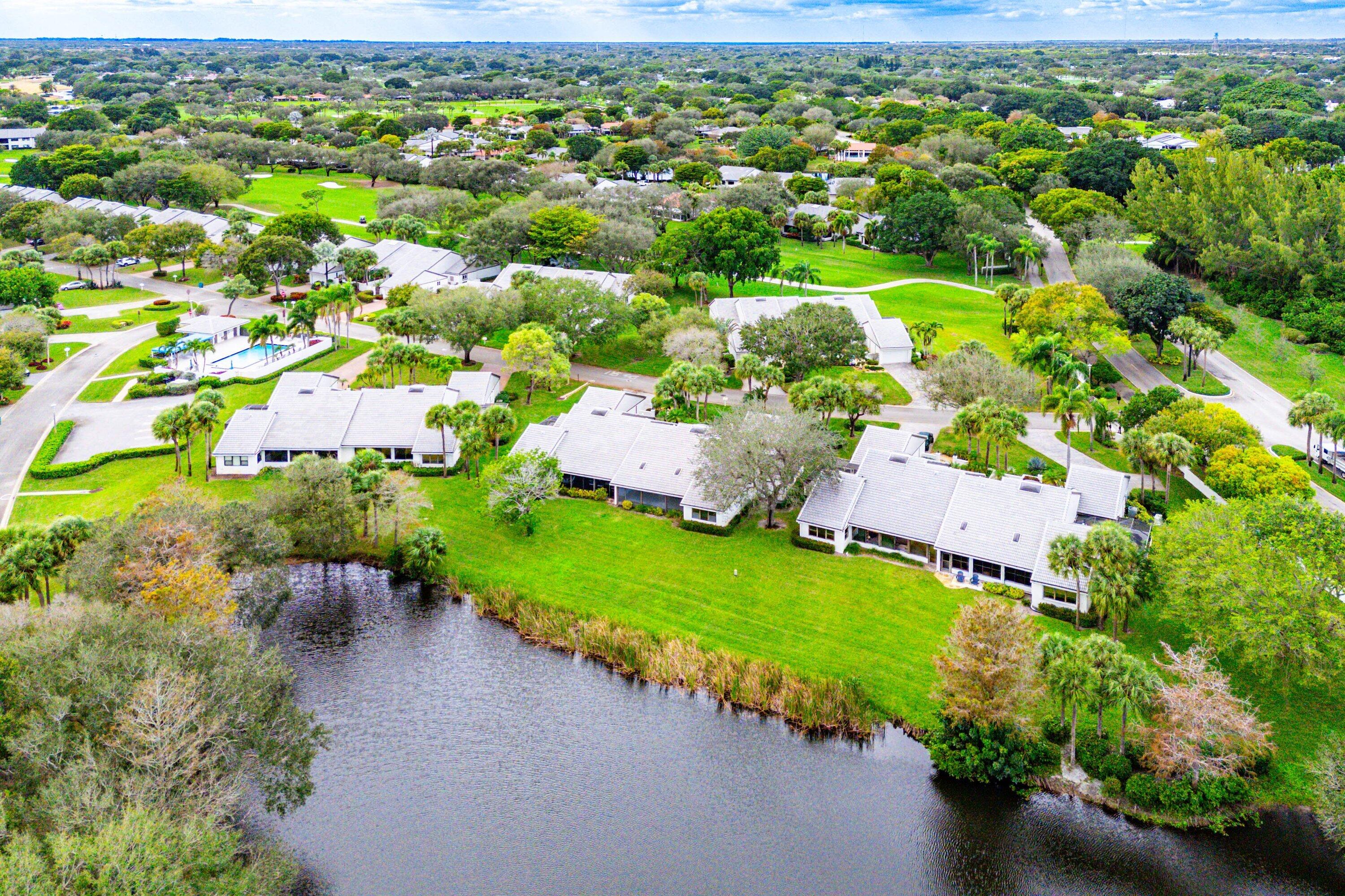 6 Clubhouse Lane Boynton Beach, FL 33436 - Photo 70 of 76 an aerial view of a house with a garden