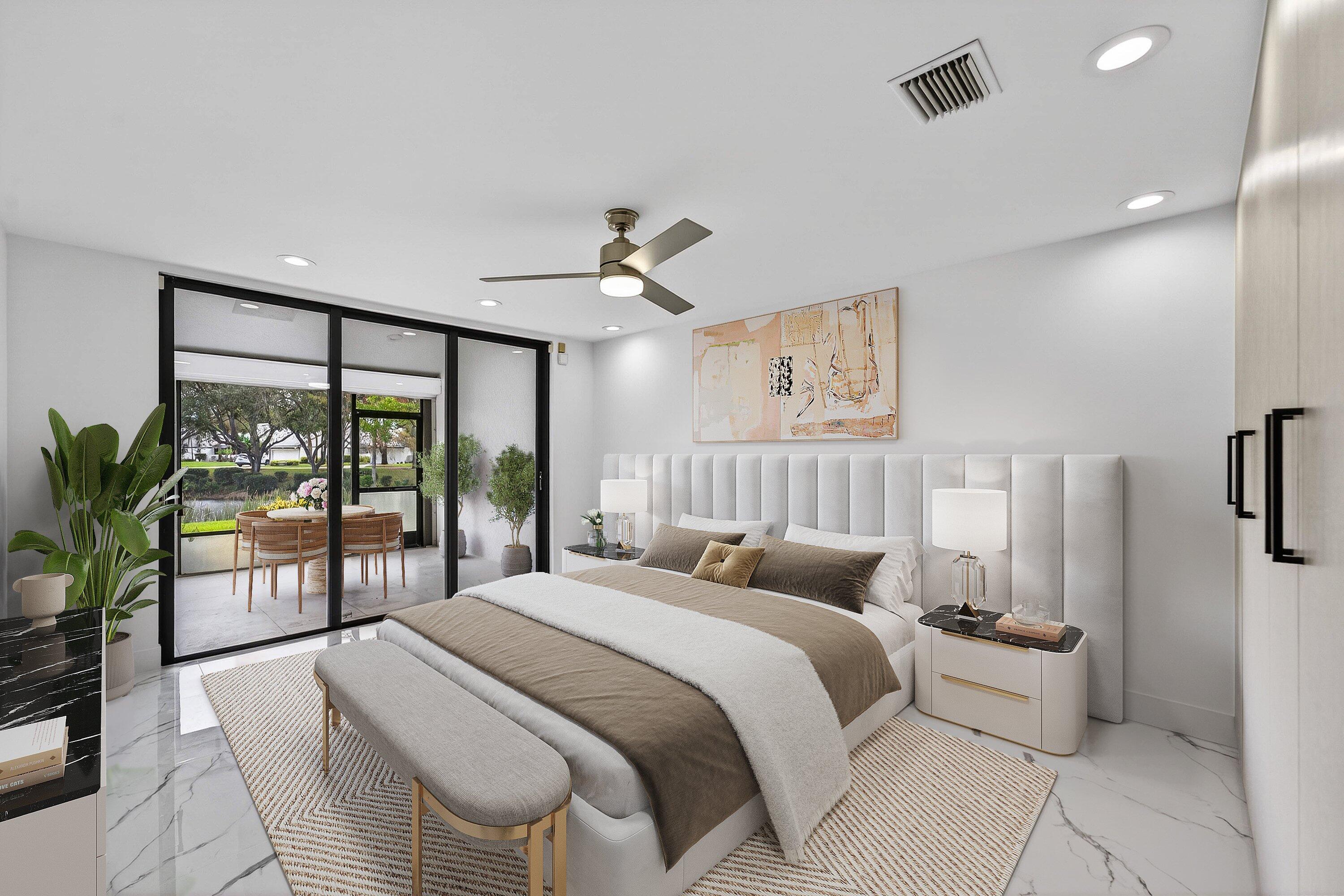 6 Clubhouse Lane Boynton Beach, FL 33436 - Photo 10 of 76 a bedroom with a large bed and a large window