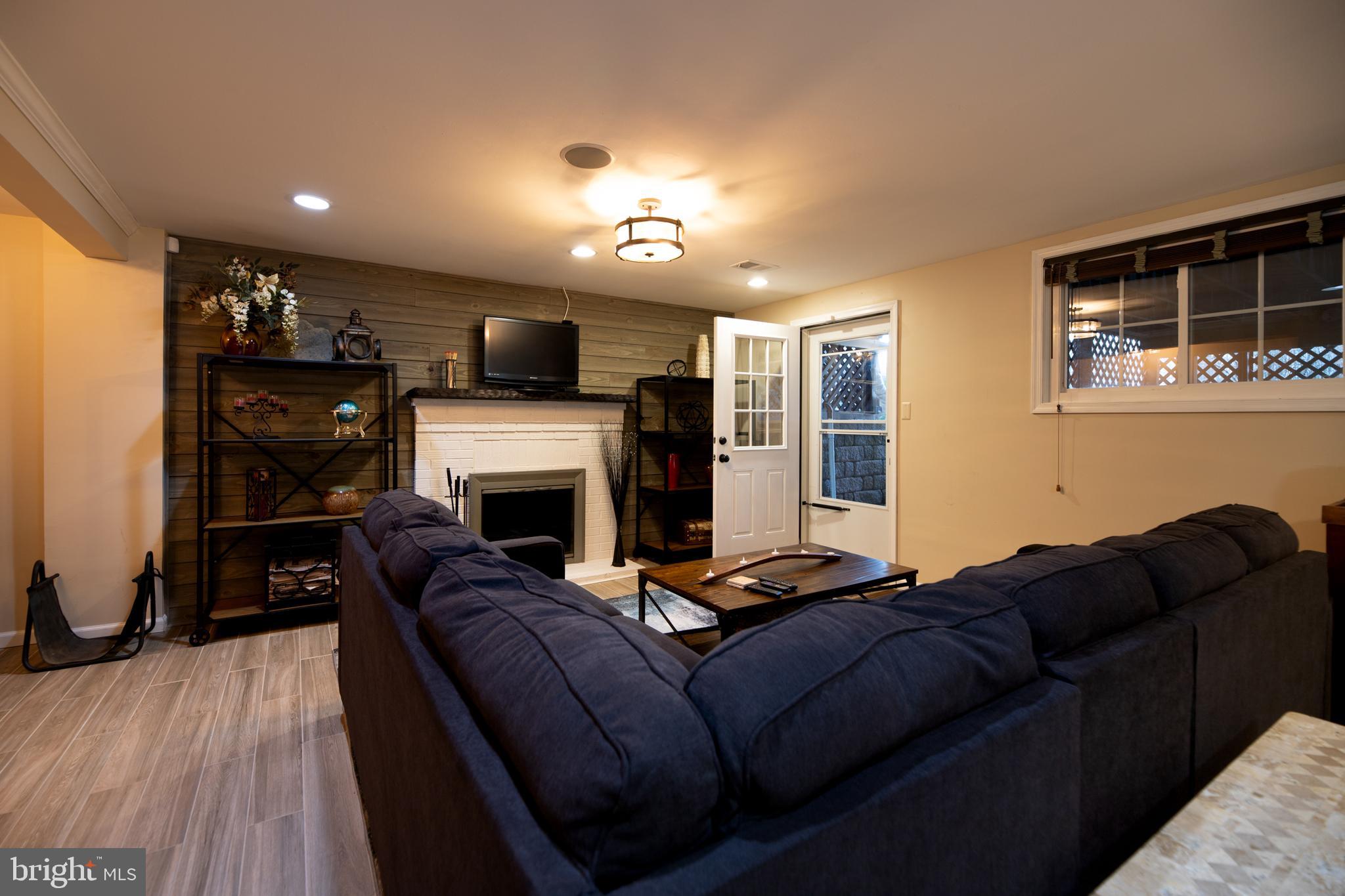 14712 Harold Road Silver Spring, MD 20905 - Photo 27 of 37 Finished Walkout Basement w/Fireplace