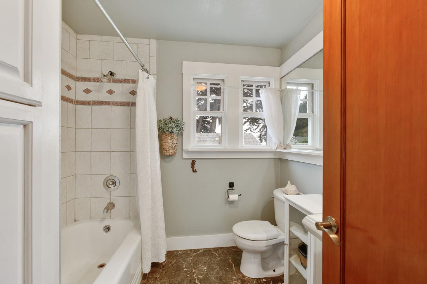 554 Brighton Road Pacifica, CA 94044 - Photo 15 of 50 a bathroom with a toilet and a shower
