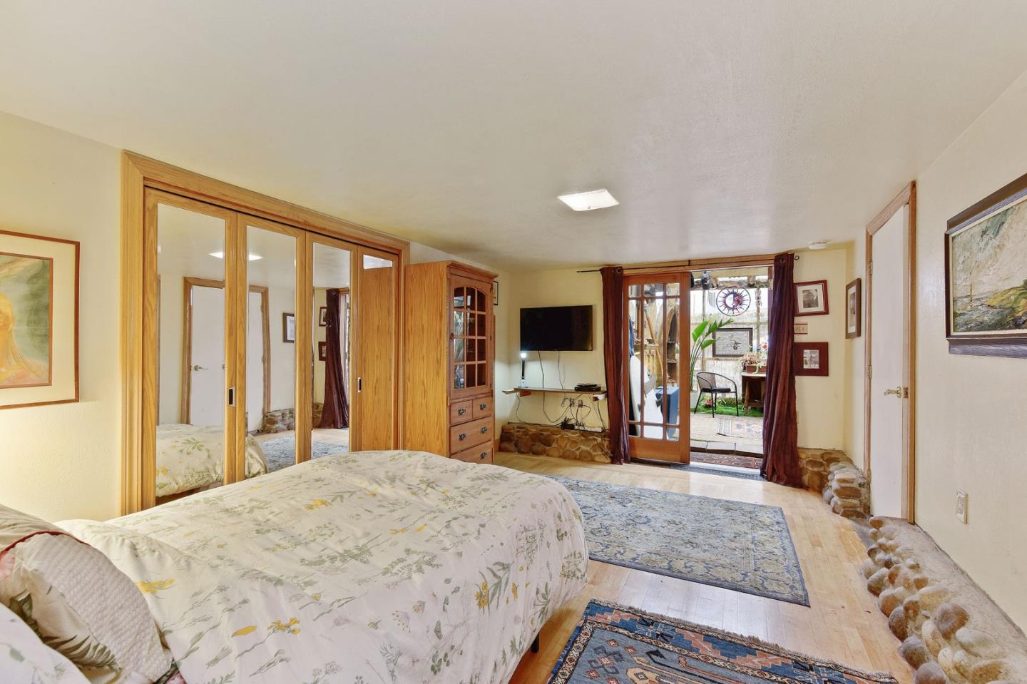 554 Brighton Road Pacifica, CA 94044 - Photo 29 of 50 a bedroom with a large bed and a large window