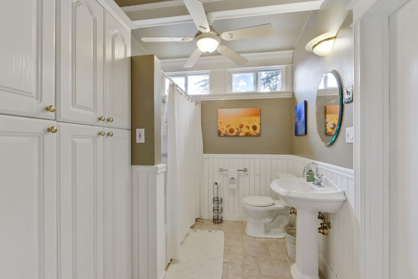 554 Brighton Road Pacifica, CA 94044 - Photo 31 of 50 a bathroom with a sink toilet and mirror