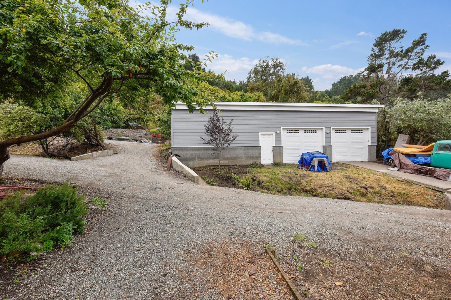 554 Brighton Road Pacifica, CA 94044 - Photo 34 of 50 a view of a house with a yard and garage