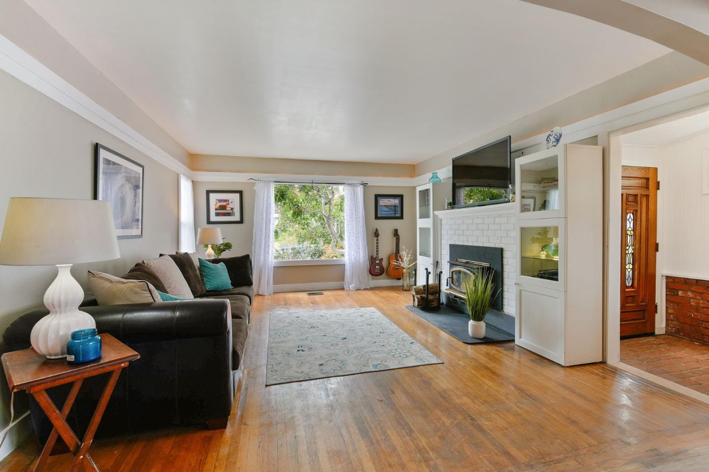554 Brighton Road Pacifica, CA 94044 - Photo 5 of 50 a living room with furniture and a fireplace