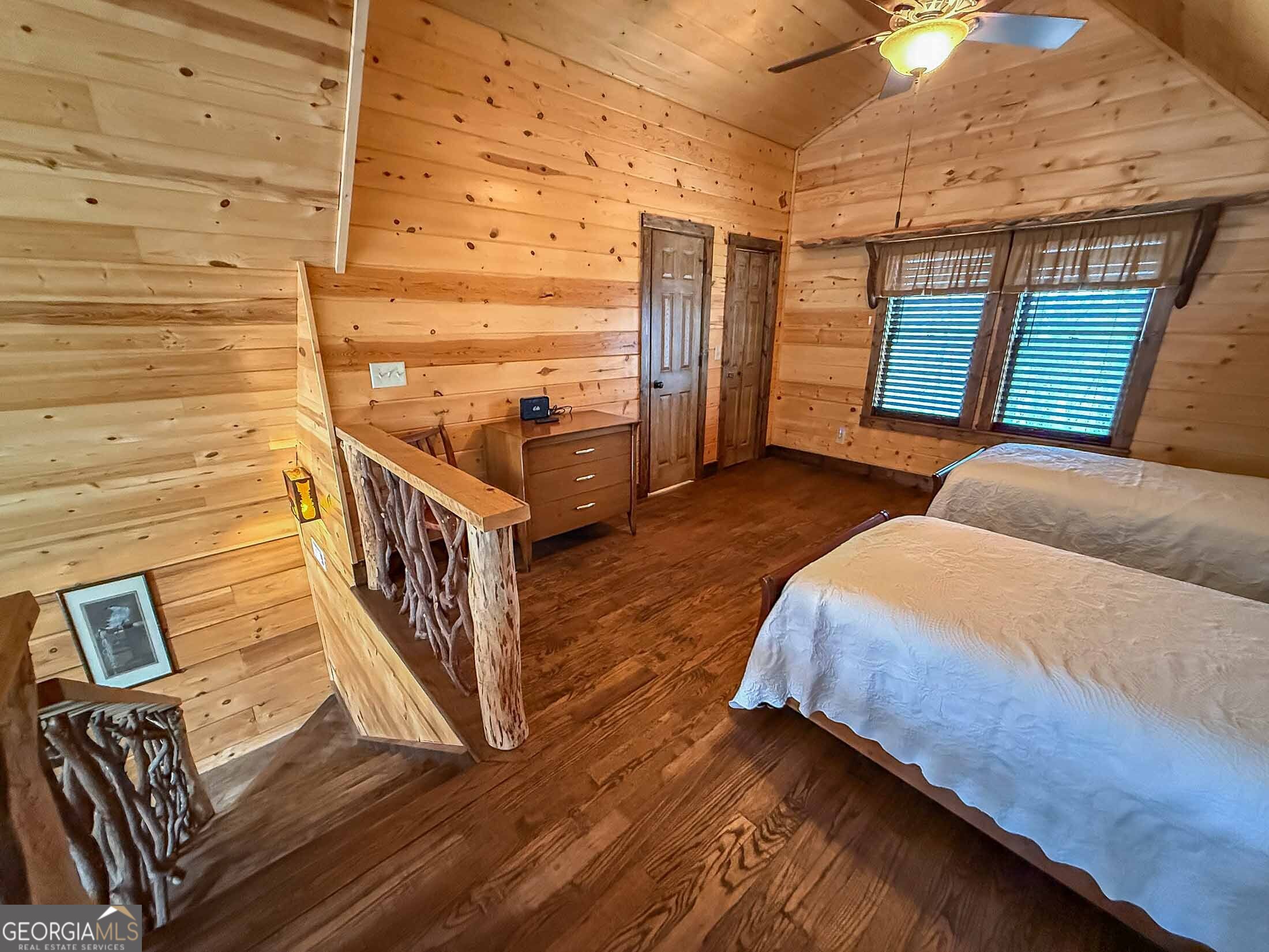 513 Coleman Heights Lane Rabun Gap, GA 30568 - Photo 11 of 36 a bedroom with a bed and wooden floor