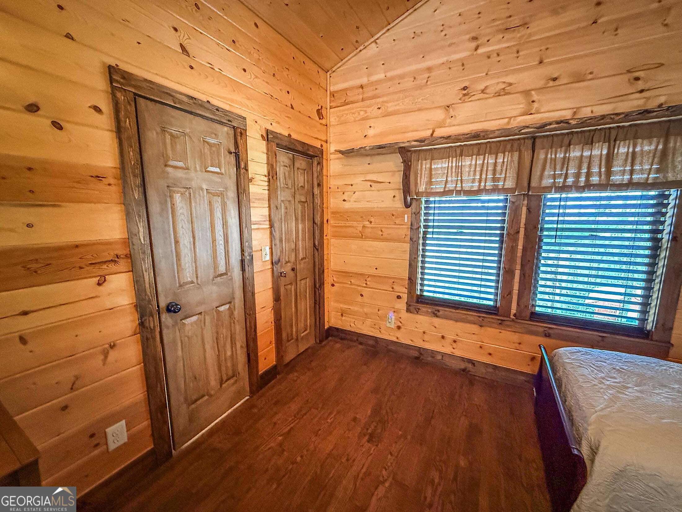 513 Coleman Heights Lane Rabun Gap, GA 30568 - Photo 14 of 36 a view of a room with wooden floor and windows