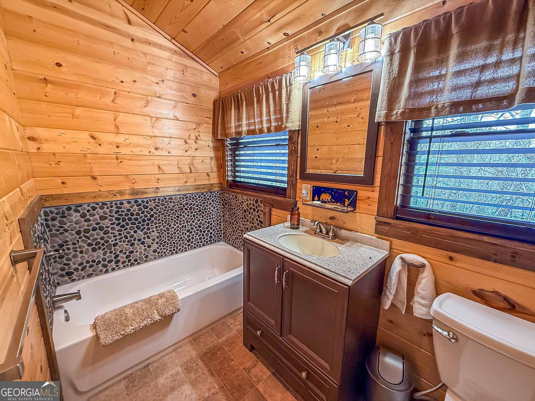 513 Coleman Heights Lane Rabun Gap, GA 30568 - Photo 16 of 36 a bathroom with a sink and a bathtub