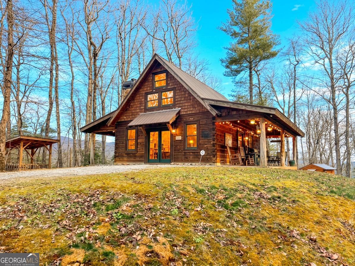 513 Coleman Heights Lane Rabun Gap, GA 30568 - Photo 2 of 36 a front view of a house with a yard