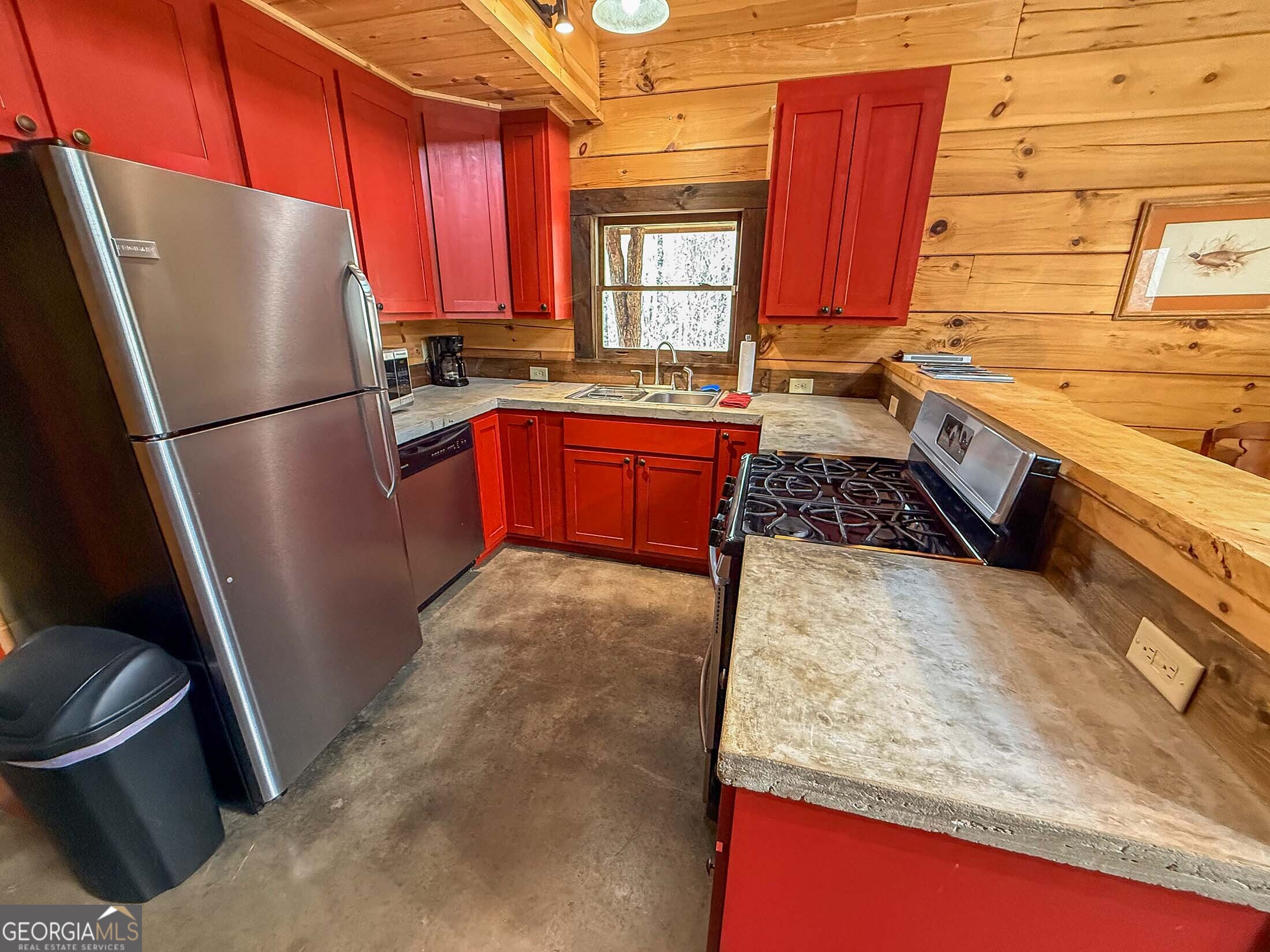 513 Coleman Heights Lane Rabun Gap, GA 30568 - Photo 22 of 36 a kitchen with granite countertop a refrigerator stove and sink