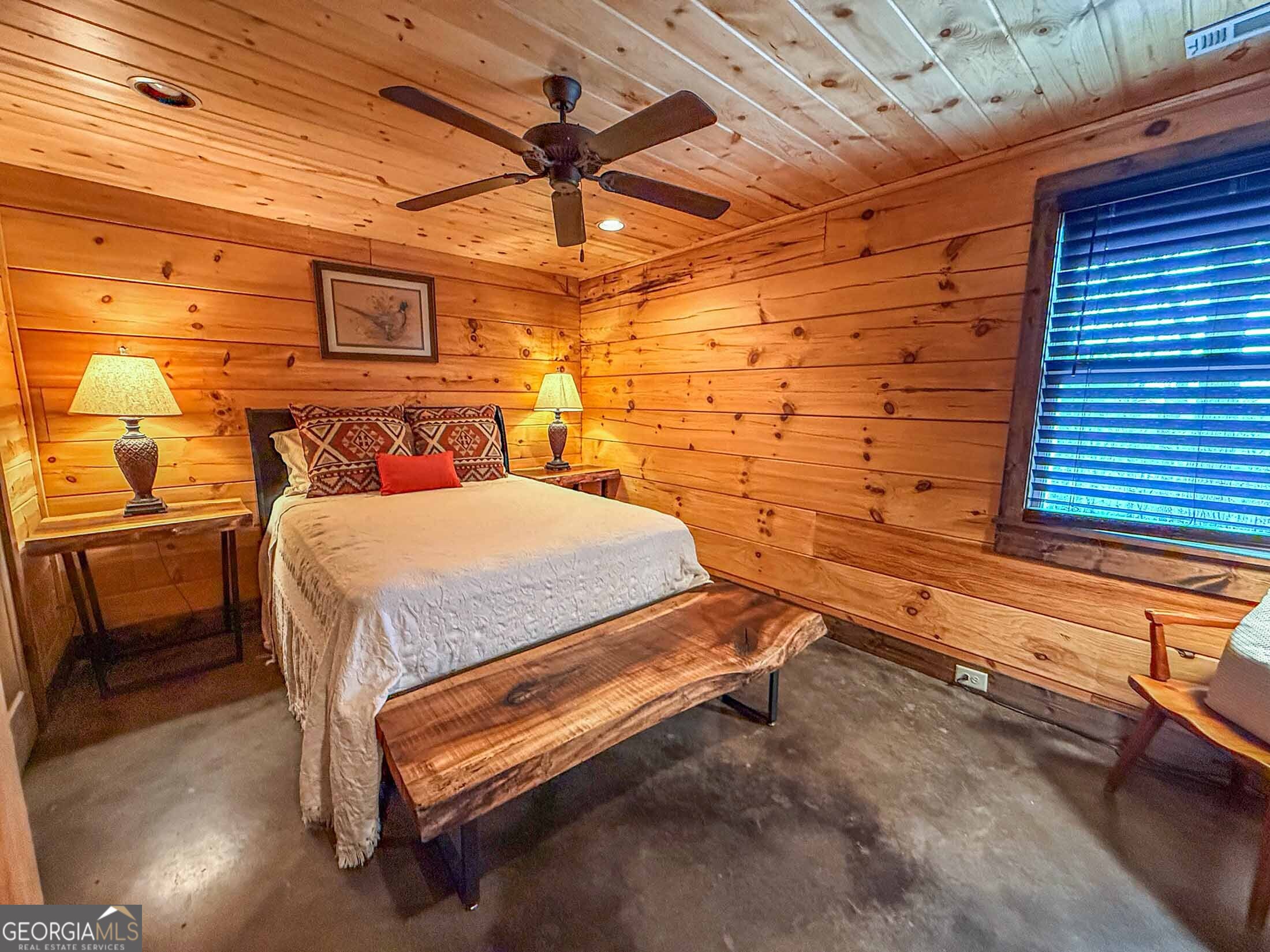 513 Coleman Heights Lane Rabun Gap, GA 30568 - Photo 26 of 36 a bedroom with a bed and a chandelier