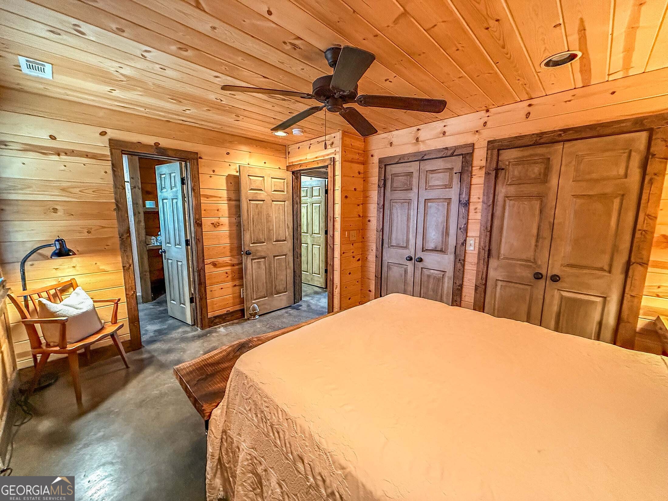 513 Coleman Heights Lane Rabun Gap, GA 30568 - Photo 28 of 36 a bedroom with a bed and wooden floor