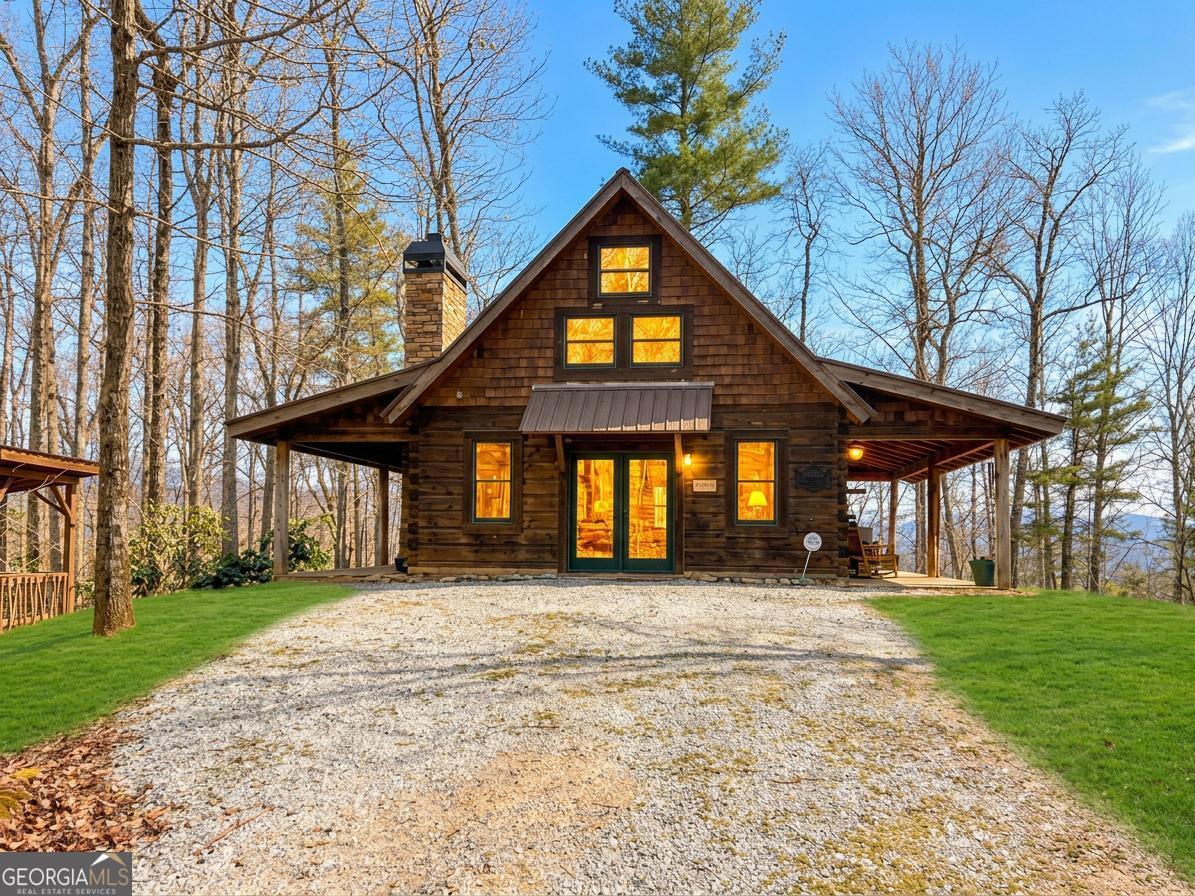 513 Coleman Heights Lane Rabun Gap, GA 30568 - Photo 3 of 36 a front view of a house with a yard