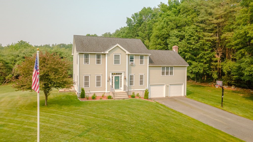 81 Ridge Road Rutland, MA 01543 - Photo 3 of 41 a front view of a house with a yard