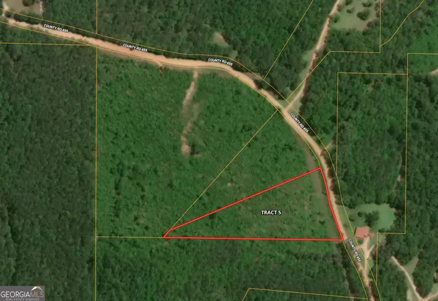 a view of a yard from a balcony