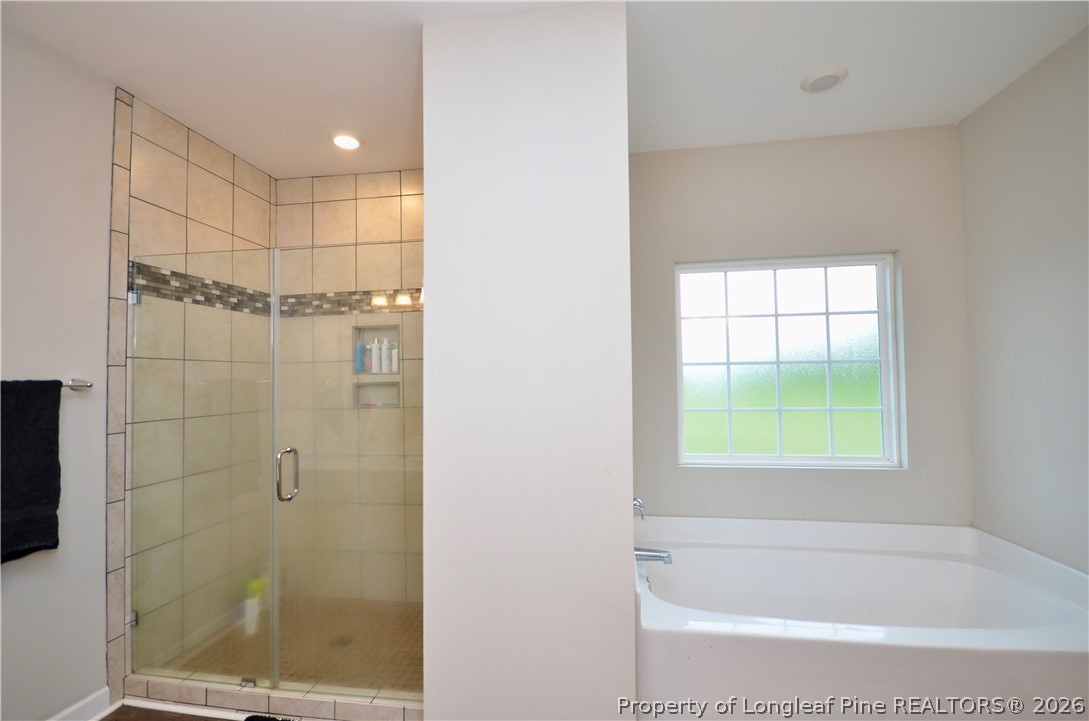 1865 John B Carter Road Fayetteville, NC 28312 - Photo 18 of 49 a bathroom with a bathtub and shower