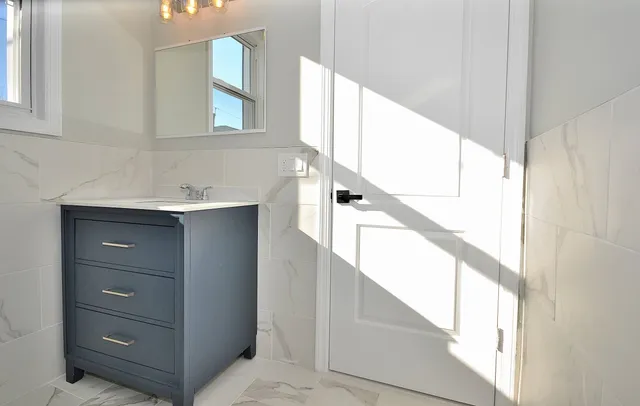 a bathroom with a sink and a mirror
